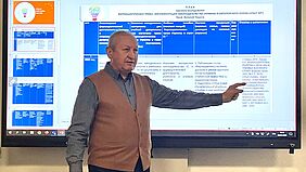 A Ukrainian colleague presents his research results on a monitor